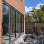 Aluminium bi-fold doors in anthracite grey external view