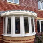 uPVC double glazed flush fit windows on a curved bay window