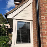 Cream uPVC double glazed flush fit windows on a bay window