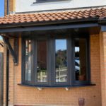 Anthracite uPVC double glazed flush fit windows on a bay window